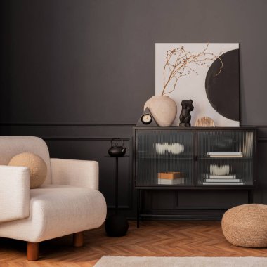 Creative composition of living room interior with mock up poster frame, glass sideboard, vase with dried flowers, modular sofa, wooden floor, dark wall and personal accessories. Home decor. Template.