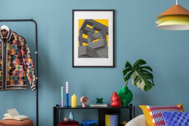 Modern and colorful interior of living room with design boucle sofa, mock up poster, shelf, plants, decorations and personal stuff. Home decor.	