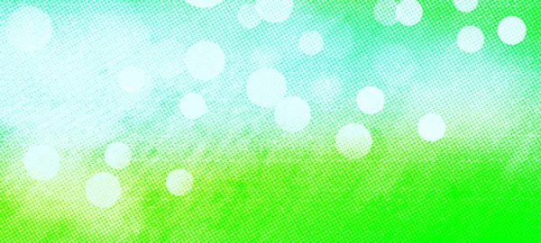 Green widescreen bokeh background. Simple design backdrop for banners, posters, and various design works