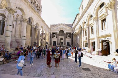  Split, Croatia -  oct 02, 2022 - Tourists stroll in Split city center on Peristil square in front of Saint Domnius cathedral and bell tower landmarks, Croatia.