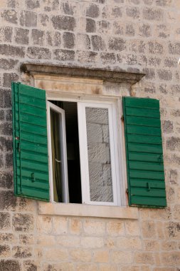 Picturesque narrow street with stone houses. Scene with old houses and old narrow alley. Trogir, Dalmatia, Croatia, Europe