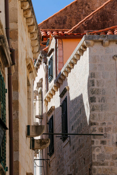 Architecture of old town, buildings with stone wall. Travel, adventure concept. City background. Dubrovnik, Croatia