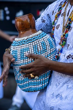 Afro Brazilian shekere beaded gourd drum close-up with colorful beads. Used in samba, songs and candomble clipart