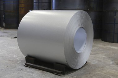 Roll of steel sheet in a plant. Rolls of sheet steel of Factory. Coils of steel stripes in store. steel coils in warehouse, heavy industries. rolls of steel sheet in a plant, galvanized coil.