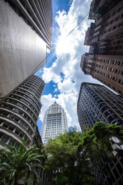 Old Center of Sao Paulo, Brazil. Altino Arantes Building (white), also known as Banespa or Santander and the Martinelli Building (brown) seen from a low angle, on a sunny day clipart