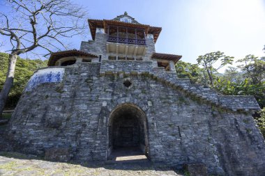 Serra do Mar State Park, Sao Bernardo do Campo, Sao Paulo, Brazil - 18 june, 2025. A large, two storey 17th century house made of stone and blue tiles, on a summer day in the heart of the Serra do Mar. 