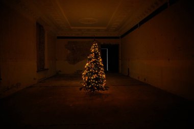 Kharkiv, Ukraine - December 2022: Christmas tree in the destroyed building of the regional council of the Kharkiv region. 