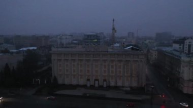 Kharkiv, Ukraine - December 2022: Destroyed building of the regional council of Kharkiv region, Freedom Square. Consequences of the Russian-Ukrainian war. Aerial view 