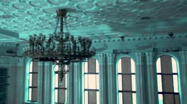 Kharkiv, Ukraine - December 2022: Destroyed building of the regional council of Kharkiv region. Consequences of the Russian-Ukrainian war. View Inside. vintage chandelier