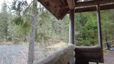 A forest path in the mountains of Ukraine. High mountain lake Synevyr. Wooden gazebo in the mountains. Old wooden house in the forest.