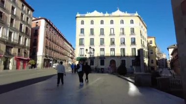 Spain, Madrid - March 13, 2023: Walking through the streets of the city. Central Street. People go for a stroll through the sights of the city. Architecture of the old city.