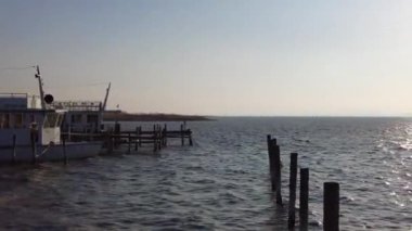Neusiedl, Podersdorf am See, Burgenland, Austria - 4, March 2023: View of the lighthouse, wooden pier