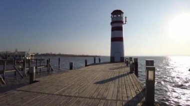 Neusiedl, Podersdorf am See, Burgenland, Austria - 4, March 2023: View of the lighthouse, wooden pier