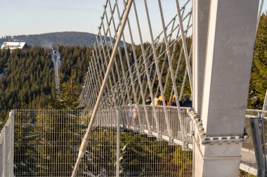 Sky Bridge 721, Lower Moravia, Czech Republic - December 1, 2024: The longest pedestrian suspension bridge in the world. Mountain resort Dolni Morava in the Czech Republic. clipart