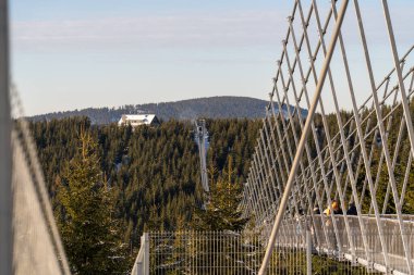 Sky Bridge 721, Lower Moravia, Czech Republic - December 1, 2024: The longest pedestrian suspension bridge in the world. Mountain resort Dolni Morava in the Czech Republic. clipart