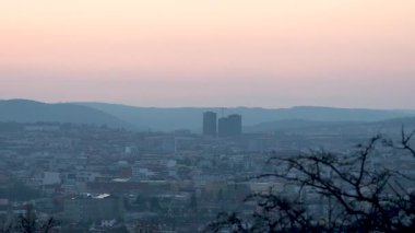 Brno, Czech Republic - March 29, 2025: View of the city from above at night. Evening city panorama. Shpilberk Castle.