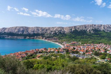 KRK Island, Bashka, Croatia - April 18, 2025: View of the mountains and the village of Bashka. Panorama of beautiful mountains and the sea.