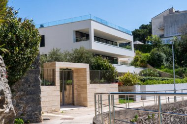 KRK Island, Croatia - April 19, 2025: Cityscape. View of urban real estate. Villa by the sea.