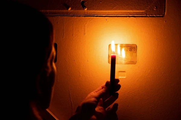 Woman Hand Holds Candle Next Shield Meter Apartment Ukraine Electricity — Stock Photo, Image