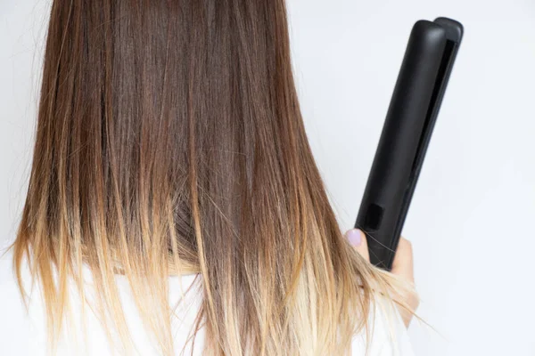 Girl Straightens Her Hair Straightening Tongs White Background Hair Care — Stock Photo, Image
