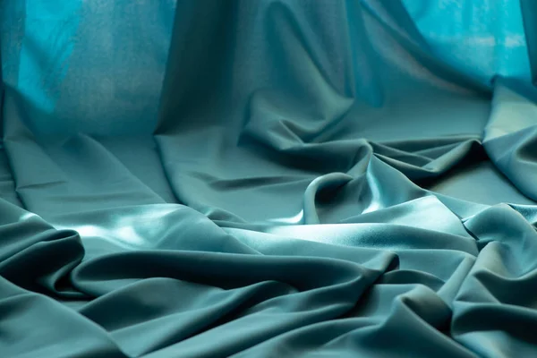 Blue wrinkled plain fabric as background