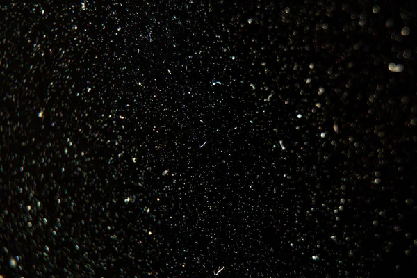 Dust on a black TV screen macro photo, dust on a black background as a macro background