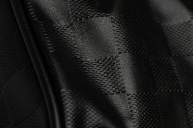 Siyah kareli sahte deri arka planda kırışıklıklar, siyah deri arka plan