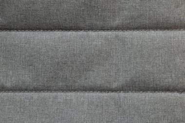 İki paralel çizgisi olan gri tekstil kumaşı, yakın plan.