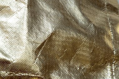 Yağ bezi desenli altın yaldızlı arkaplan, arkaplan ve şablonlar için parlatıcı ve katlı soyut materyal, altın arkaplan