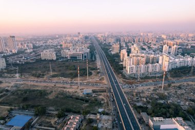 aerial drone still shot showing busy sohna elevated highway toll road with traffic stuck at interesction due to road construction of bridge or underpass India