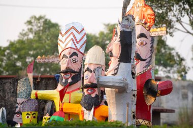 Colorful effigies of demon king Ravan of paper made on the hindu festival of Dussehra Vijayadashami shot with shallow depth of field in India