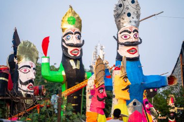 Colorful effigies of demon king Ravan of paper made on the hindu festival of Dussehra Vijayadashami shot with shallow depth of field in India