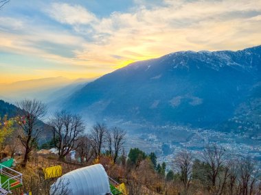 geodesic and swiss tents overlooking manali valley at sunset at a popular glamping spot near hampta village for eco freindly and comfortable adventure stays clipart