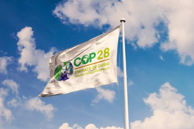 November 10, 2022, Brazil. The 2023 United Nations Climate Change Conference COP28 soon appears on a flag. Event will be on 6-17 November 2023, in Emirate of Dubai, United Arab Emirates clipart