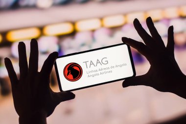 January 19, 2023, Brazil. In this photo illustration, the TAAG Linhas Areas de Angola logo is displayed on a smartphone screen. It is the national airline of Angola, having its headquarters in Luanda.