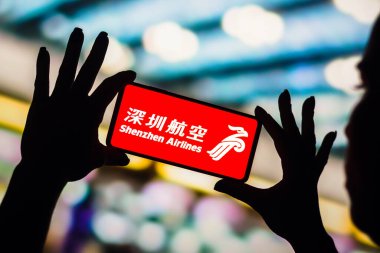 February 4, 2023, Brazil. In this photo illustration, the Shenzhen Airlines logo is displayed on a smartphone screen