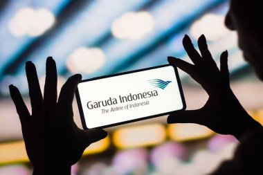 February 4, 2023, Brazil. In this photo illustration, the Garuda Indonesia logo is displayed on a smartphone screen