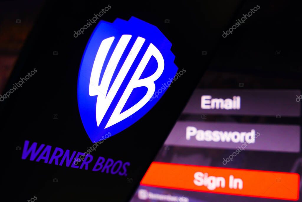 May 2, 2023, Brazil. In this photo illustration, the Warner Bros. Entertainment logo is displayed on a smartphone screen, next to a login screen, with email, password and sign in