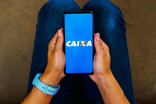 May 27, 2023, Brazil. In this photo illustration, the Caixa Econmica Federal (CEF) logo is displayed on a smartphone screen.