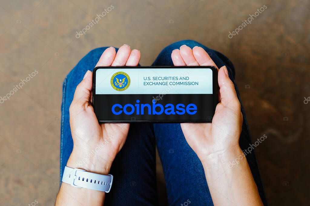June 11, 2023, Brazil. In this photo illustration, the Securities and Exchange Commission (SEC) and Coinbase logo is displayed on a smartphone screen