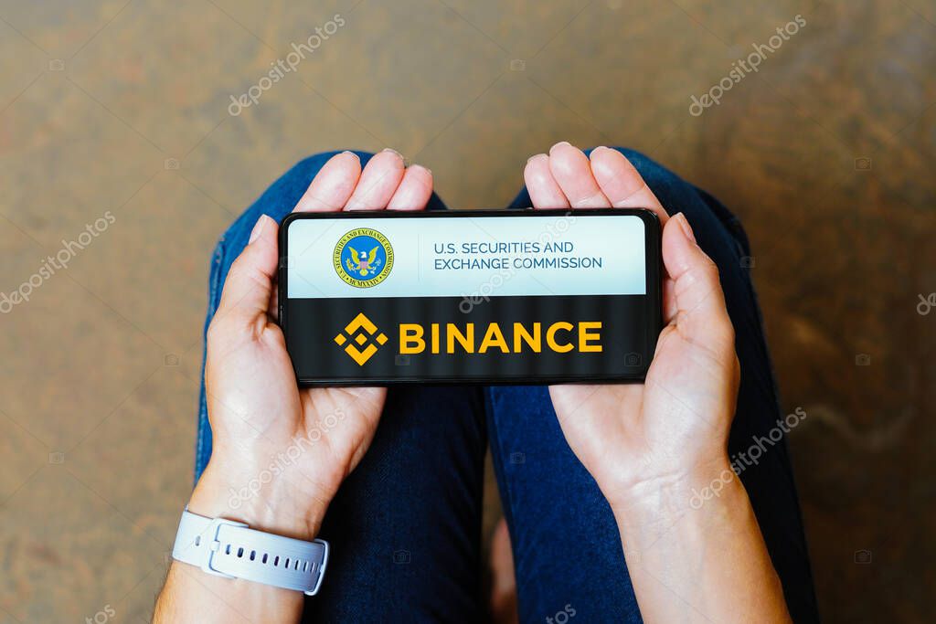 June 11, 2023, Brazil. In this photo illustration, the Securities and Exchange Commission (SEC) and Binance logo is displayed on a smartphone screen
