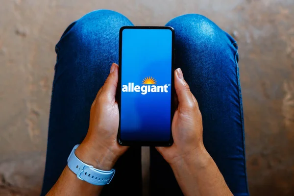 stock image June 16, 2023, Brazil. In this photo illustration, the Allegiant Air logo is displayed on a smartphone screen