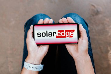 July 2, 2023, Brazil. In this photo illustration, the SolarEdge logo is displayed on a smartphone screen clipart