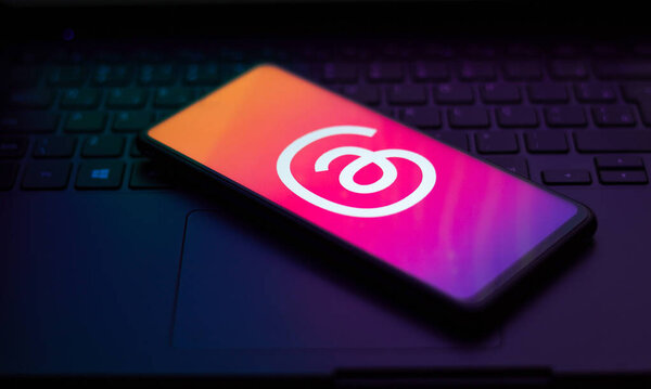 July 5, 2023, Brazil. In this photo illustration, the Threads logo is displayed on a smartphone screen. Threads is the new social network and messaging app from Meta Platforms