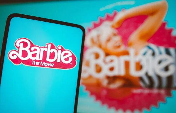 stock image July 21, 2023, Brazil. In this photo illustration, the Barbie the movie logo seen displayed on a smartphone. Barbie is a 2023 American fantasy comedy film Based on the Barbie fashion dolls by Mattel