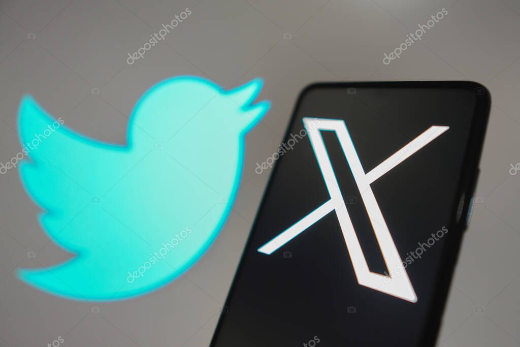 July 24, 2023, Brazil. In this photo illustration, the Twitter (X) new logo seen displayed on a smartphone. In the background, the old bluebird social network logo