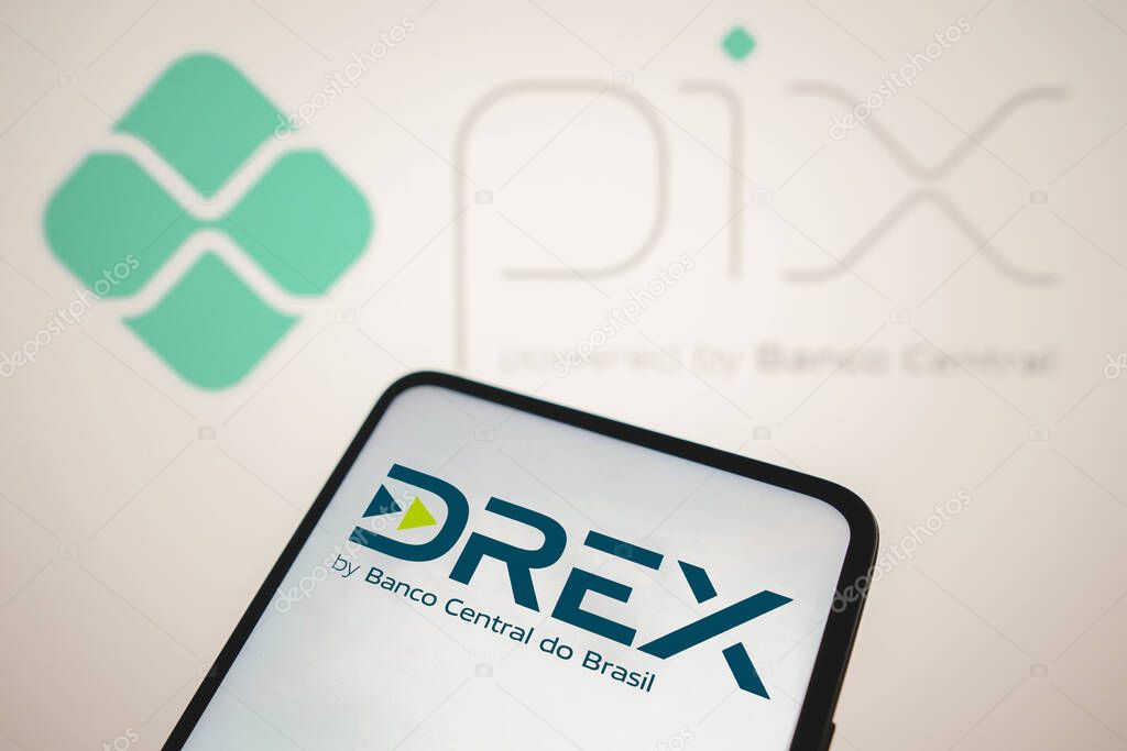 August 8, 2023, Brazil. In this photo illustration, the Drex logo seen displayed on a smartphone. Drex is the new Brazilian digital currency launched by the Central Bank. In the background the PIX logo