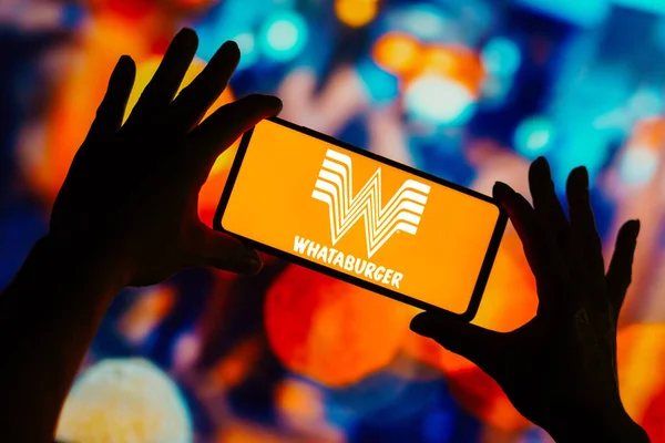 stock image August 20, 2023, Brazil. In this photo illustration, the Whataburger logo seen displayed on a smartphone