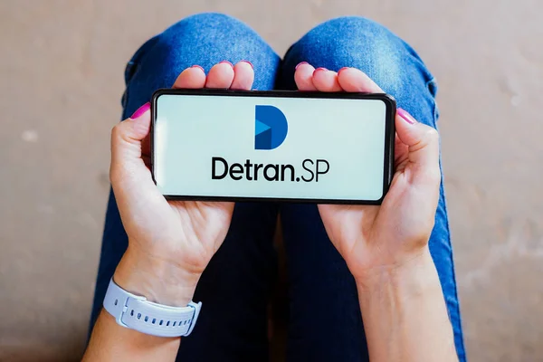 stock image August 30, 2023, Brazil. In this photo illustration, the Detran SP logo is displayed on a smartphone screen