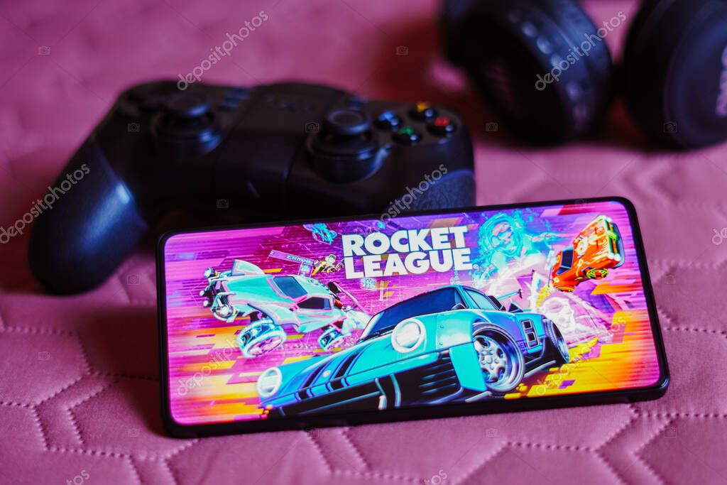 October 9, 2023, Brazil. In this photo illustration, the Rocket League logo is displayed on a smartphone screen, next to a gamepad